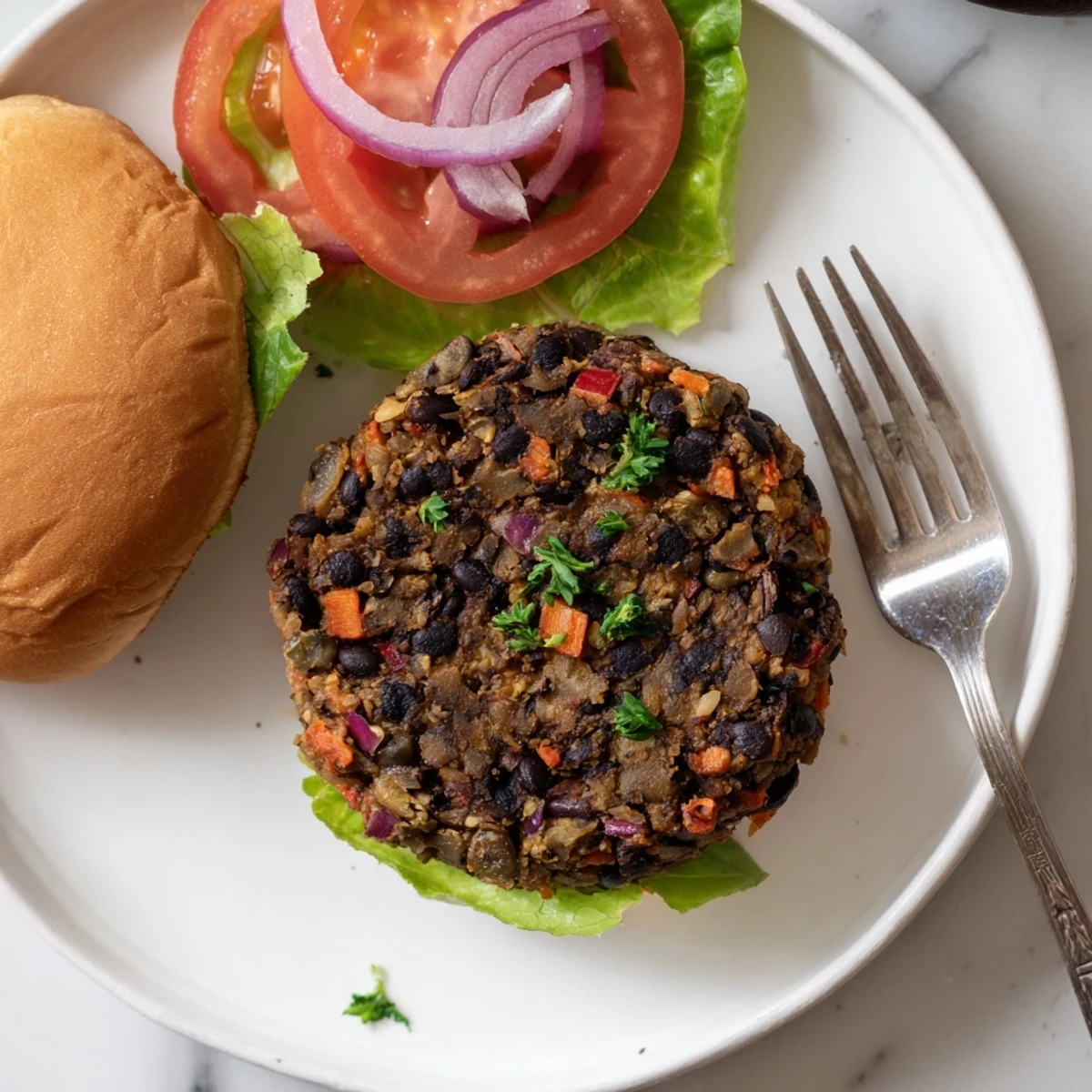 Golden brown mushroom veggie burger on a toasted bun with fresh lettuce and juicy tomato slices