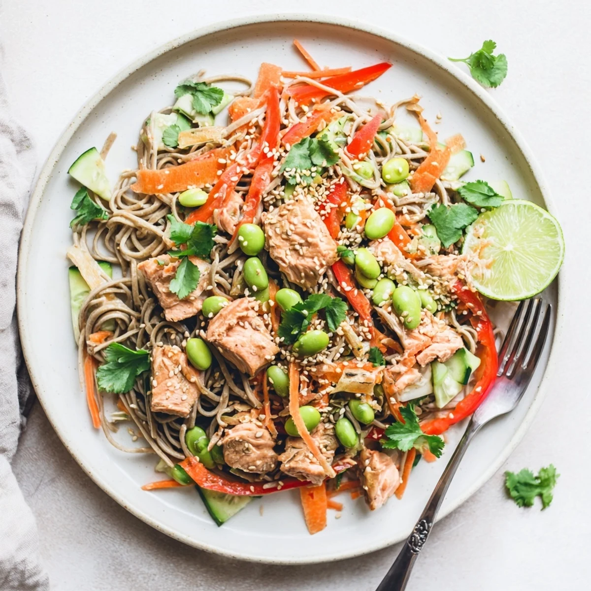 Refreshing Japanese-inspired teriyaki salmon and soba noodle salad tossed in tangy sesame dressing with toasted seeds