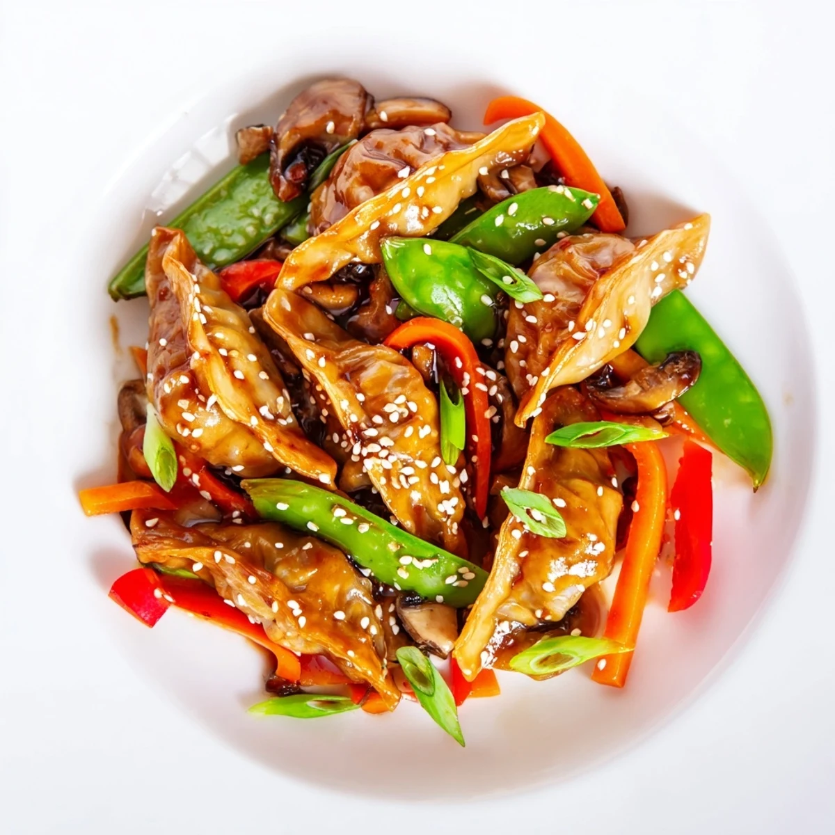 Golden potstickers tossed with colorful crisp vegetables in a savory glossy stir-fry sauce