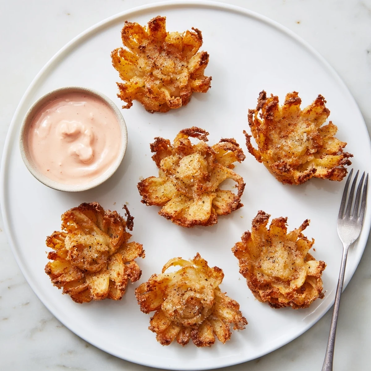 Crispy mini bloomin onions recipe showcasing golden battered petals perfect for party appetizers