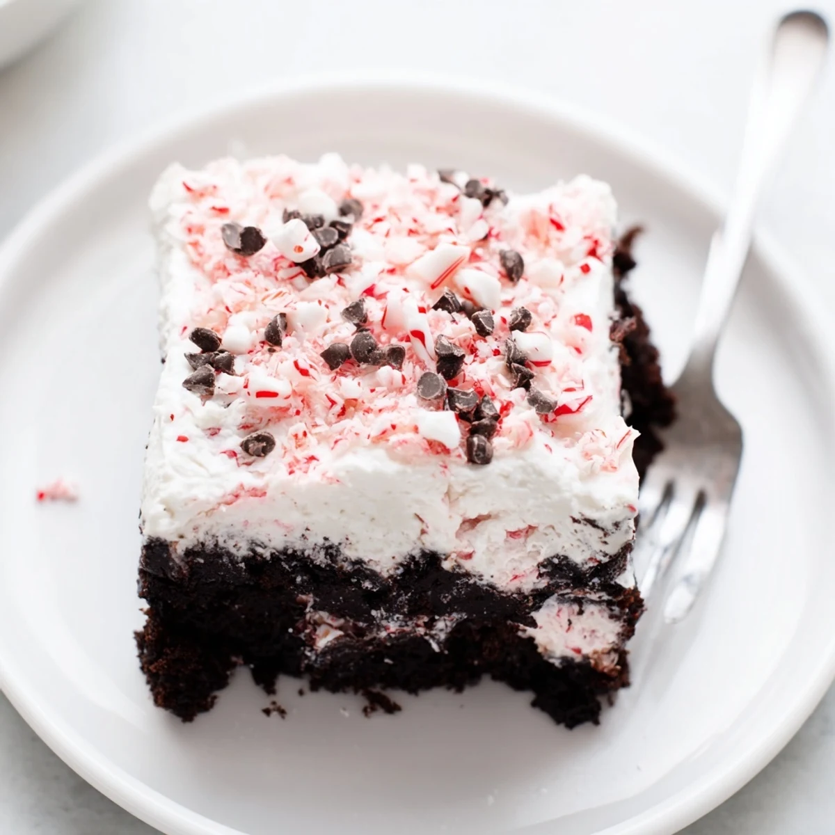 Homestyle Peppermint Poke Cake with moist chocolate crumb and cool mint