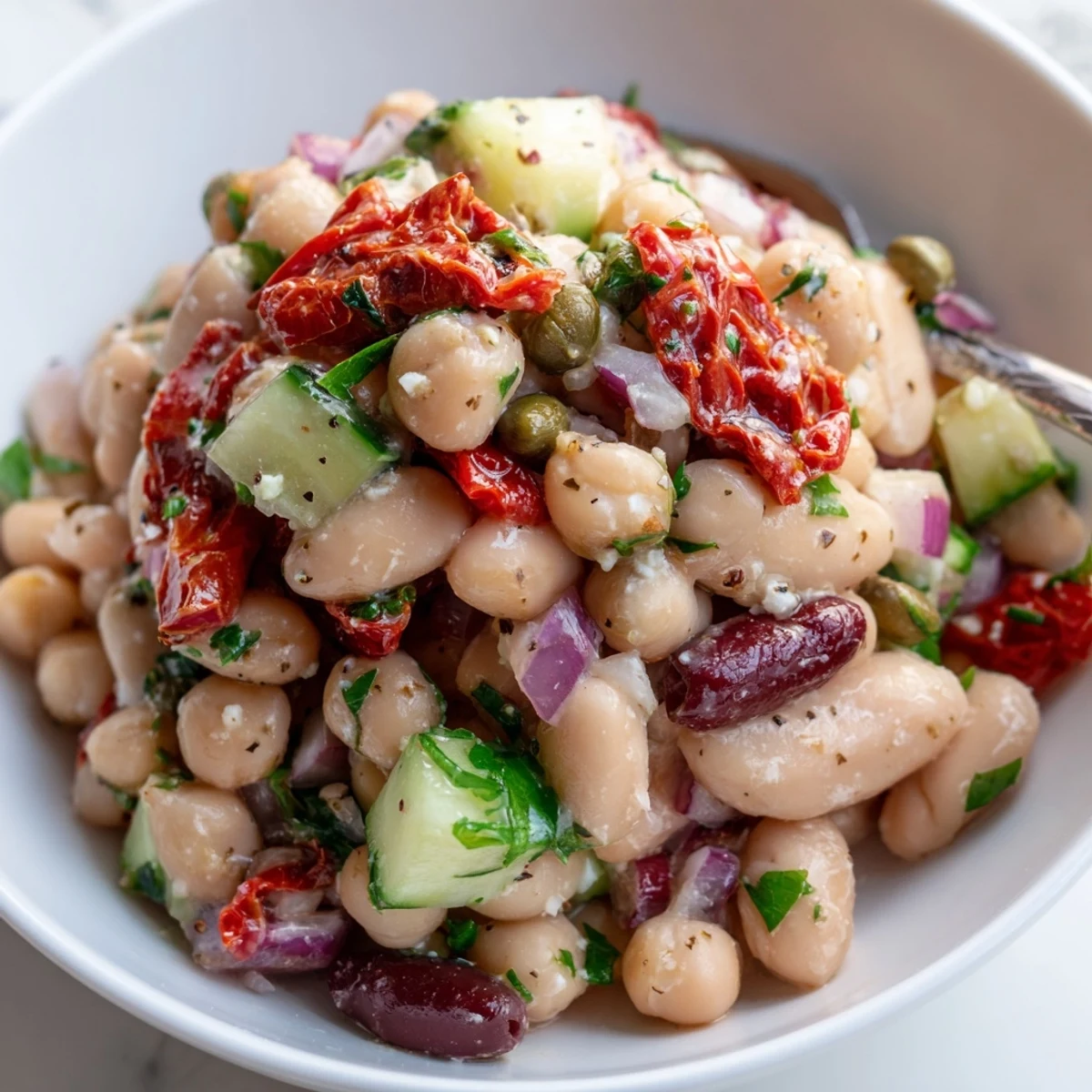 Chilled Dense Bean Salad With Sun Dried Tomatoes served with crusty bread.