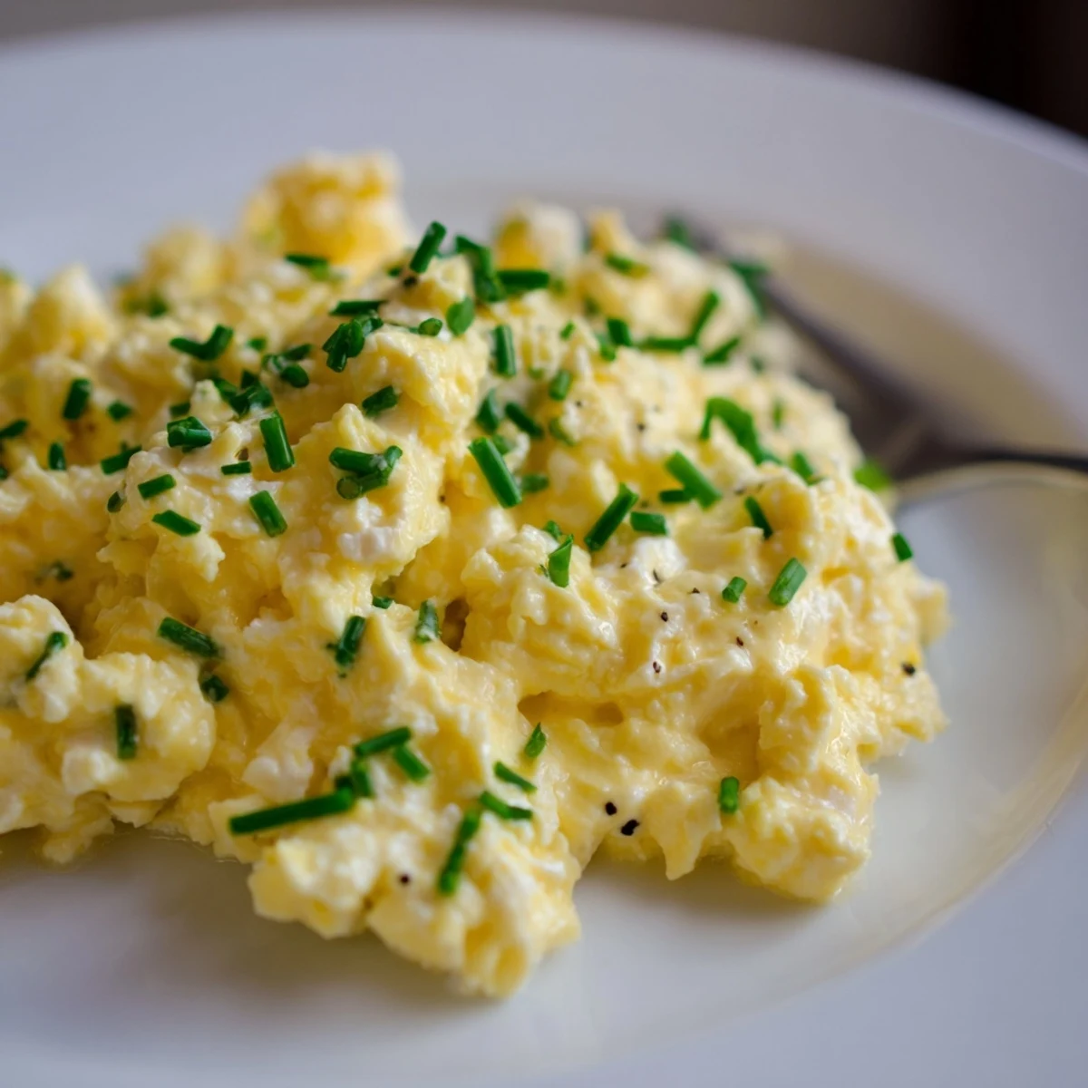 Savory Cottage Cheese Scrambled Eggs with Chives on toasted sourdough, bright chive garnish