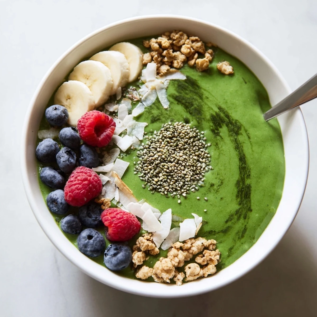 Creamy Green Smoothie Bowl with Spirulina, Banana & Hemp Seeds served chilled  